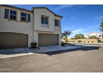 Inviting home with two-car garage, meticulously landscaped front yard, and charming architectural details at 2754 S Apache Dr, Chandler, AZ 85286