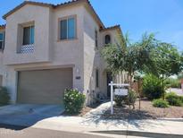 Inviting two-story home with a two car garage, well-maintained landscaping, and a 'For Sale' sign at 2754 S Apache Dr, Chandler, AZ 85286