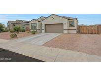 Charming single-story home with a two-car garage and a low maintenance desert landscape at 30777 W Whitton Ave, Buckeye, AZ 85396