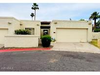 Inviting single-story home with desert landscaping, two-car garage, and neutral color palette at 4727 E Euclid Ave, Phoenix, AZ 85044