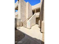 Modern condo exterior showcasing a secure entryway with unit numbers and well-maintained landscaping at 5035 N 17Th Ave # 205, Phoenix, AZ 85015