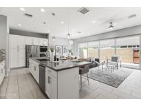 Modern, open-concept kitchen featuring stainless steel appliances and a large island at 7472 E Paraiso Dr, Scottsdale, AZ 85255