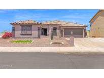 Charming single-story home with desert landscaping and a tile roof at 10536 W Villa Hermosa --, Peoria, AZ 85383