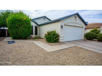 Charming single-story home featuring a well-maintained front yard and a two-car garage at 11022 N 60Th Dr, Glendale, AZ 85304