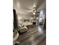 Cozy living room featuring a fireplace and comfortable seating arrangement, perfect for relaxation at 1601 N Saba St # 255, Chandler, AZ 85225
