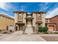 Charming two-story home with attached garage and well-maintained front yard at 1733 N 77Th Dr, Phoenix, AZ 85035