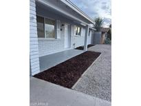Charming covered front porch with painted brick and new landscaping at 1813 E Boise St, Mesa, AZ 85203