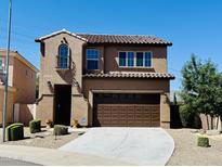 Charming two-story home with a well-manicured front yard and a spacious two-car garage at 7312 S 13Th Way, Phoenix, AZ 85042