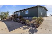 Charming single-story home features a well-manicured yard and a welcoming entrance at 13020 N 18Th St, Phoenix, AZ 85022