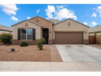 Charming single-story home with a desert landscape, two-car garage and covered entry at 13612 W Desert Moon Way, Peoria, AZ 85383