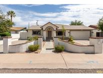 Charming single-story home with a landscaped front yard and inviting entryway at 3307 E Roveen Ave, Phoenix, AZ 85032