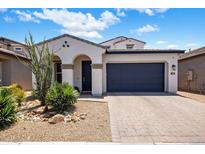 Charming single-story home with a well-manicured front yard and two-car garage at 6623 E Marisa Ln, Phoenix, AZ 85054