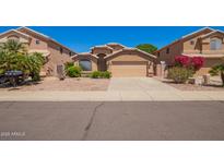 Charming single-Gathering home with well-kept landscaping, a neutral color scheme and a two car garage at 8648 W Fargo Dr, Peoria, AZ 85382