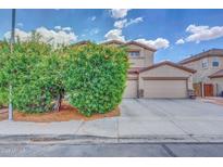Two-story home with a three-car garage and mature desert landscaping on a sunny day at 10613 E Knowles Ave, Mesa, AZ 85209