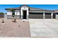 Charming single-story home with a well-manicured front yard and attached two-car garage in a suburban neighborhood at 12232 E Agave Ln, Florence, AZ 85132