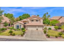 Charming two-story home featuring a three-car garage and well-manicured landscaping at 1292 N Renee Ave, Gilbert, AZ 85234