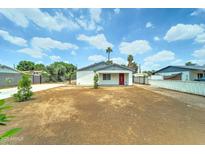 Front exterior of a cozy home with a well-maintained front yard and desert landscaping at 2148 W Hayward Ave, Phoenix, AZ 85021