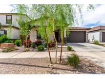 Charming home featuring a desert landscape with colorful bougainvillea and a neutral color scheme at 3053 W Straight Arrow Ln, Phoenix, AZ 85083