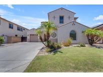 Charming two-story home with a well-maintained lawn and decorative palm trees at 6840 S Crystal Way, Chandler, AZ 85249