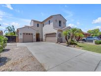 Inviting two-story home featuring a three-car garage and manicured landscaping at 6840 S Crystal Way, Chandler, AZ 85249