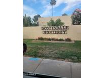 Scottsdale Monterey community sign with manicured landscaping and mature palm trees at 7914 E Bonita Dr, Scottsdale, AZ 85250