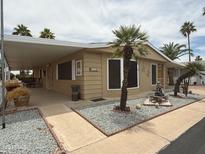 Charming single-story home with covered patio and meticulously landscaped front yard at 8103 E Southern Ave # 119, Mesa, AZ 85209