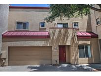 Two-story stucco home with red roof and two car garage at 1015 S Val Vista Dr # 52, Mesa, AZ 85204