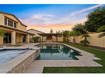 Beautiful backyard pool and spa area with a built in outdoor kitchen, perfect for entertaining at 10331 E Starion Ave, Mesa, AZ 85212