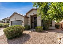 Inviting front of home with a low maintenance yard and gray garage door at 4314 E Anderson Dr, Phoenix, AZ 85032
