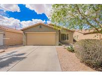 Charming single-story home with a two-car garage and low-maintenance desert landscaping at 44976 W Miramar Rd, Maricopa, AZ 85139