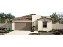 Charming single-story home with a well-maintained yard and a two-car garage at 18180 W Larkspur Dr, Goodyear, AZ 85338