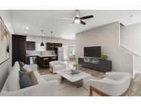 Bright, open-concept living room with modern furnishings and an adjacent kitchen, perfect for entertaining at 3010 N 37Th St # 6, Phoenix, AZ 85018
