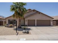 Charming home features a well-manicured front yard and a two-car garage, enhancing curb appeal at 441 E Pinto Dr, Gilbert, AZ 85296