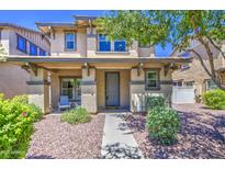Charming two-story home with a covered front porch and desert landscaping at 935 S Deerfield Ln, Gilbert, AZ 85296