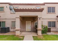 Inviting entrance with covered porch and well-maintained landscaping at 125 S 56Th St # 124, Mesa, AZ 85206