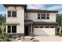 Modern two-story home with a neutral color scheme, stone accents, and a two-car garage at 1964 W Rowel Rd, Phoenix, AZ 85085