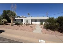 Charming single-story home with decorative concrete accents and a well-maintained desert landscape at 3125 N 82Nd Pl, Scottsdale, AZ 85251