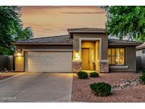 Charming home showcasing a well-maintained front yard and an attached two-car garage at 3628 E Meadowview Dr, Gilbert, AZ 85298