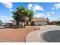 Charming single-story home featuring a well-maintained front yard and an attached two-car garage at 6614 S Mckemy St, Tempe, AZ 85283
