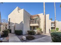 Attractive condo with private balcony, desert landscaping and inviting curb appeal on a sunny day at 9275 E Mission Ln # 206, Scottsdale, AZ 85258