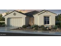 Beautiful one-story stucco home featuring desert landscaping, a two-car garage, and a tiled roof at 10155 W Columbus Ave, Avondale, AZ 85392