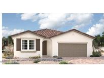 Charming single-story home features a tile roof, two-car garage, and well-maintained landscaping at 11408 S 50Th Ln, Laveen, AZ 85339