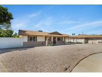 Charming single-story home featuring a well-maintained yard with gravel landscaping, and a cozy, inviting aesthetic at 1215 E Geneva Dr, Tempe, AZ 85282