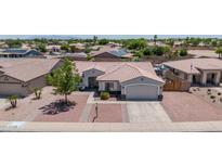 Charming single-story home with well-manicured landscaping and a spacious two-car garage at 15019 W Banff Ln, Surprise, AZ 85379