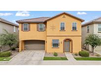 Charming two-story home with a two car garage and landscaped front yard at 2237 S Jacana Ln, Gilbert, AZ 85295