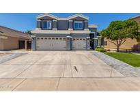 Inviting two-story home with a large driveway and attached two-car garage at 3545 W Tanner Ranch Rd, San Tan Valley, AZ 85144