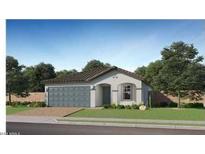 Charming single-story home featuring a two-car garage and well-maintained landscaping at 5040 S 234Th Ave, Buckeye, AZ 85326