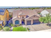 Beautiful single-Gathering home with a tile roof, manicured lawn, and a three-car garage at 710 W Ardmore Rd, Phoenix, AZ 85041