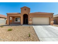 Charming single-story home featuring a tile roof, low-maintenance landscaping, and attached two-car garage at 1223 E Palo Verde Dr, Casa Grande, AZ 85122