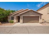 Charming single-story home with a well-maintained yard and a welcoming facade at 125 N 22Nd Pl # 53, Mesa, AZ 85213